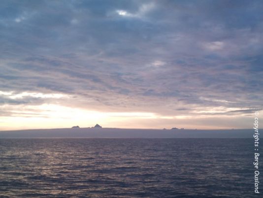 4 July / 19.00: The Lofoten Islands are within view, their jagged peaks towering above the mist.