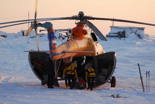 The expedition equipment is loaded onto the MI8 helicopter.