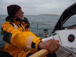 Jacques Poumet at Avannaq's helm while landing on the Head of Kinsale.